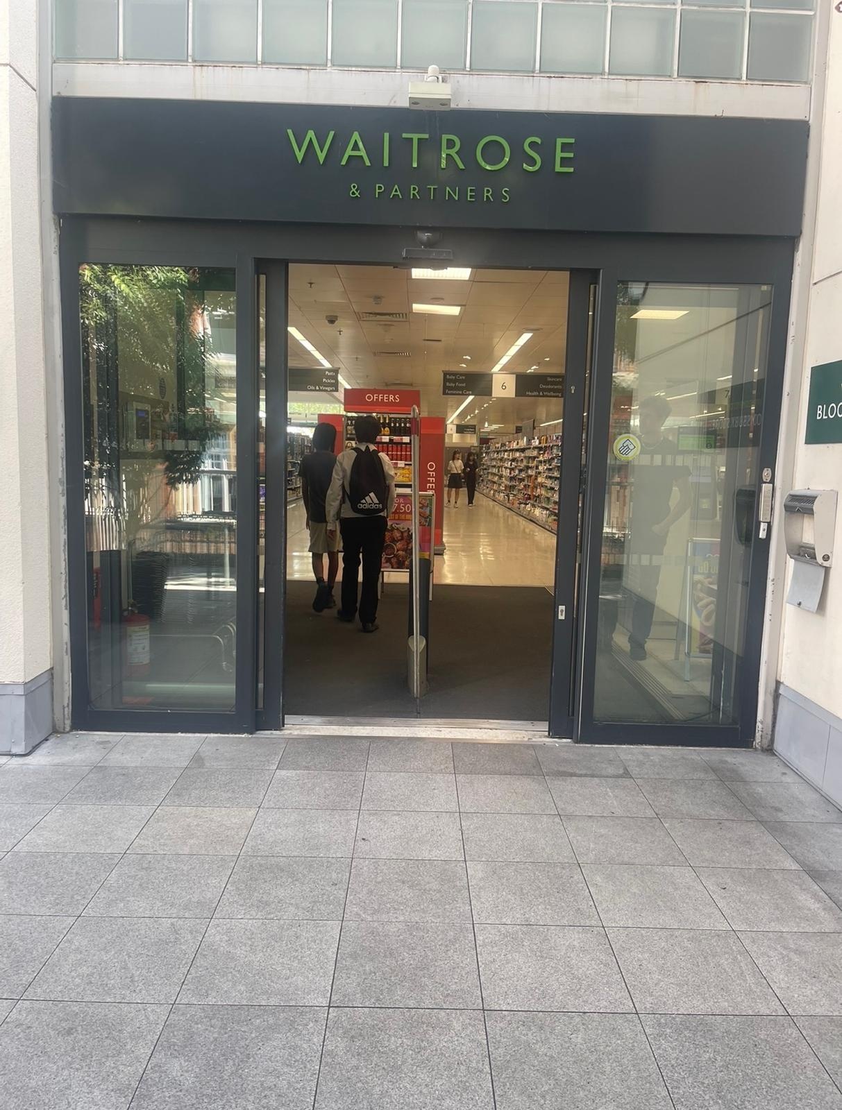 Automatic sliding doors at a supermarket entrance