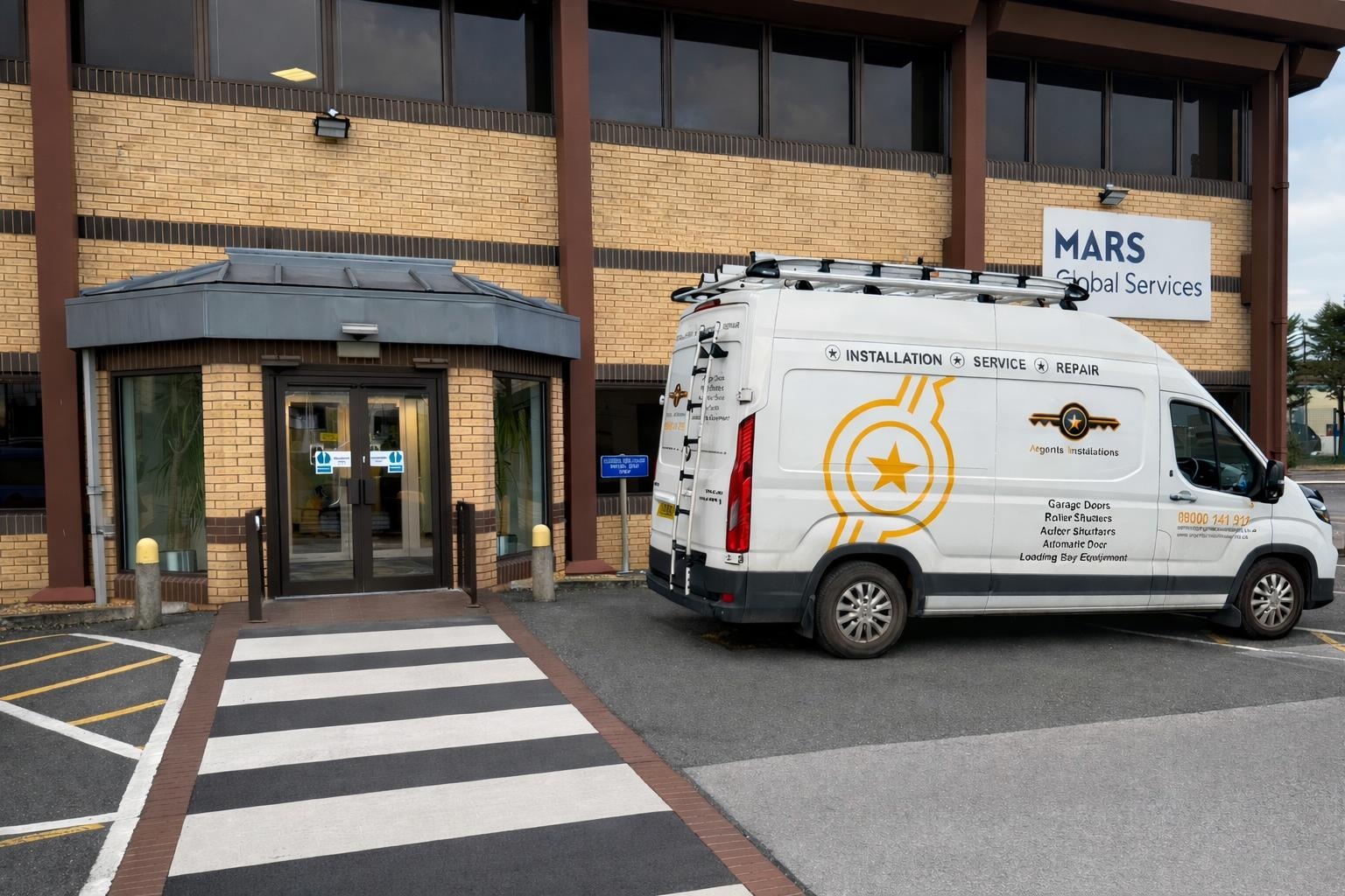 Argents Installations van on site at an automatic door installation
