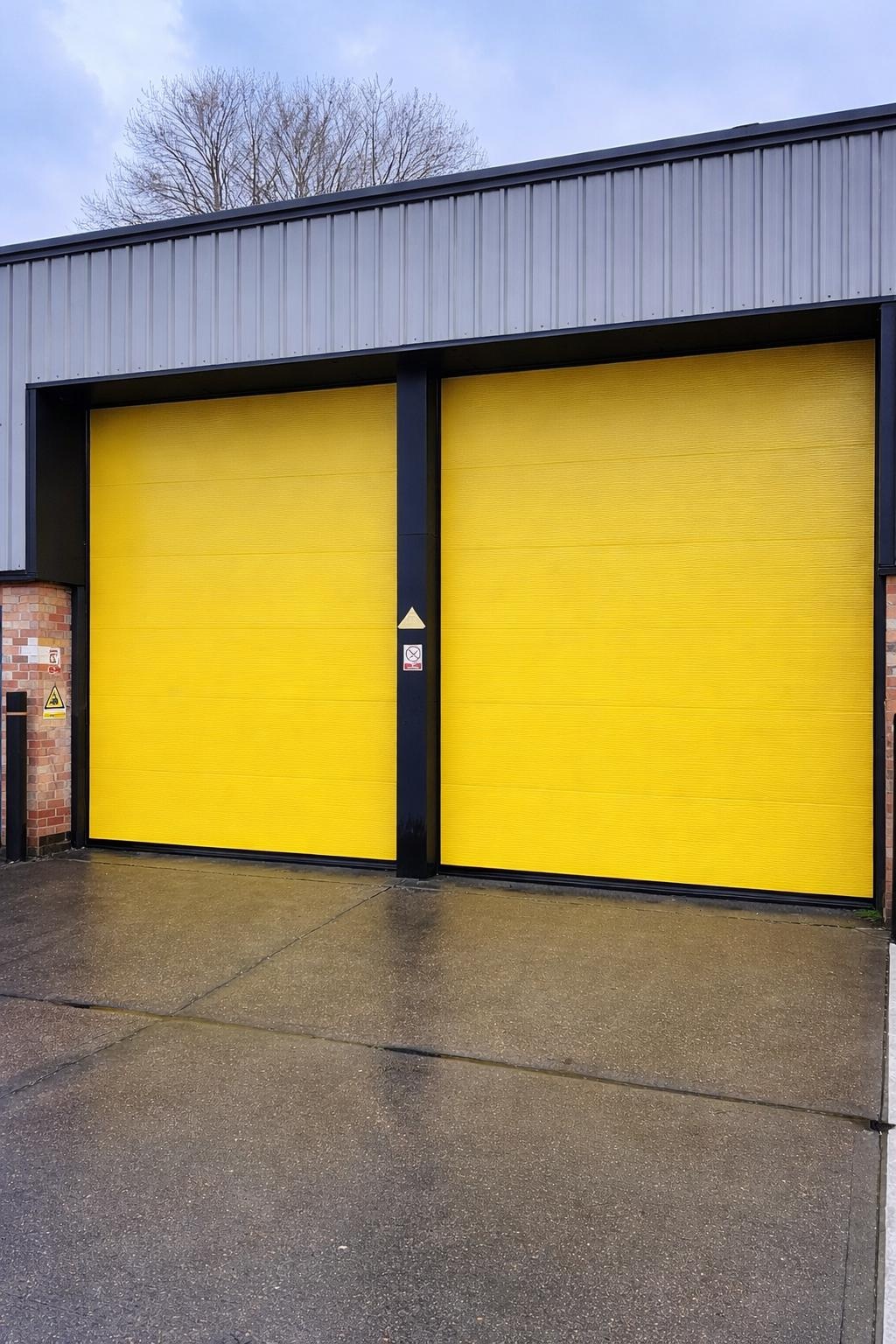 Insulated sectional overhead doors installed on an industrial unit
