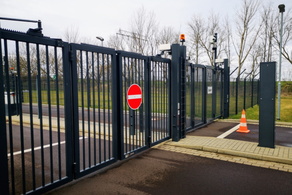 Automated sliding security gate installed at a commercial site entrance