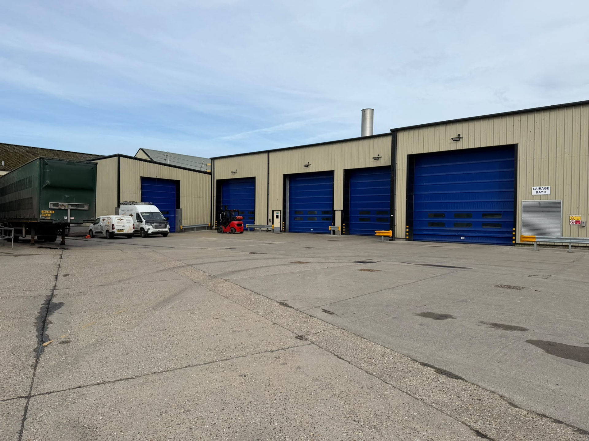Multiple warehouse bays fitted with blue high speed doors