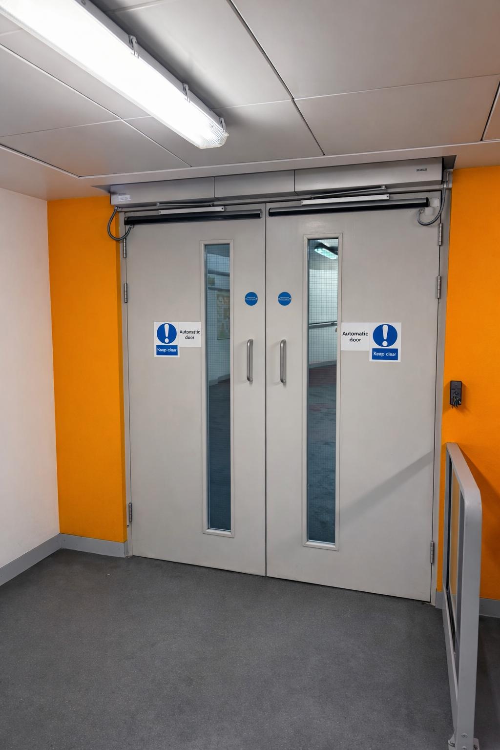 Heavy duty steel doorset installed in a commercial building corridor