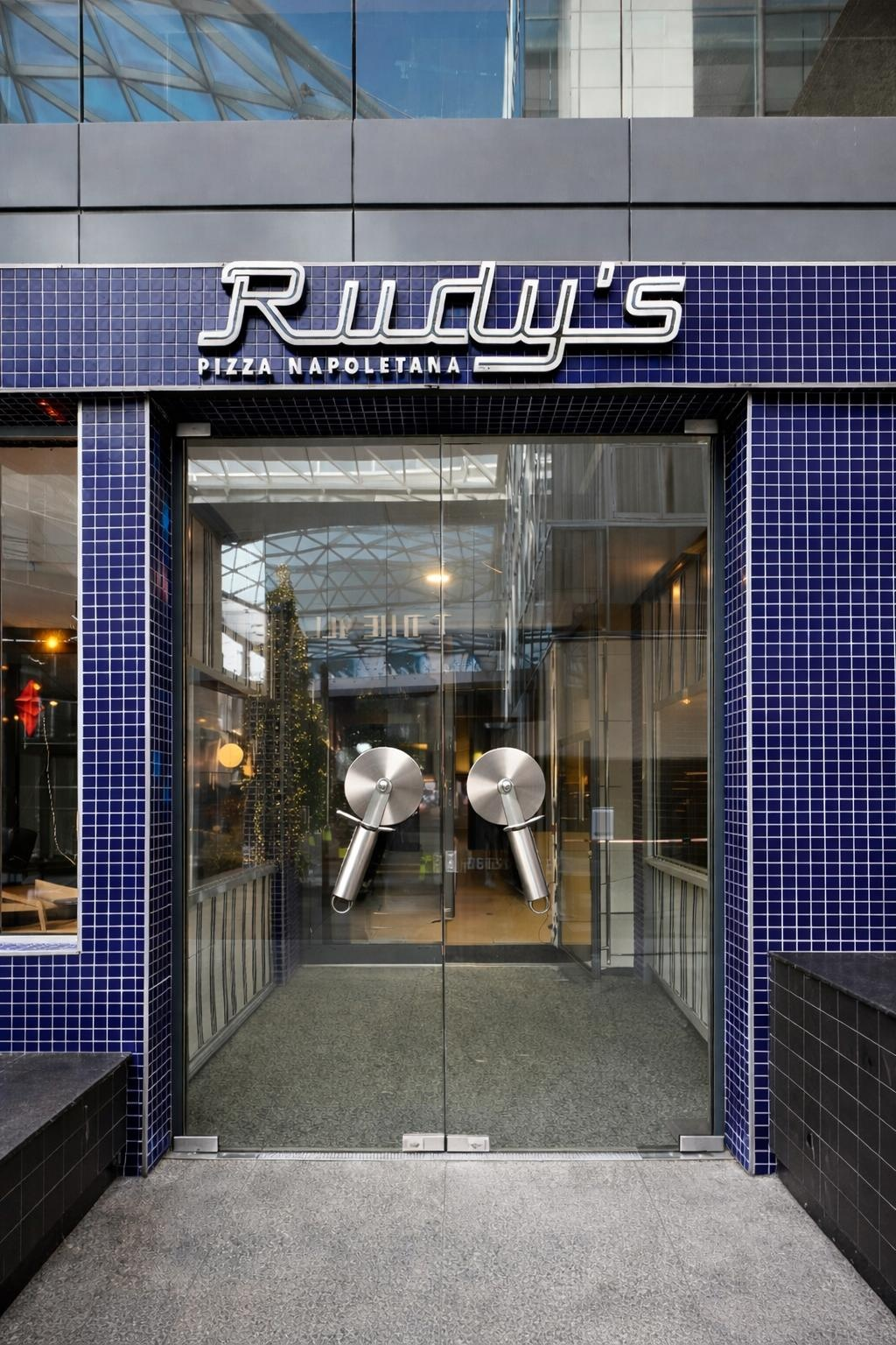 Glazed commercial entrance doors installed at a city centre restaurant shop front
